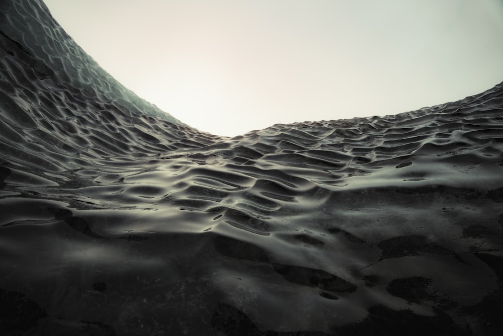 a view of the sand dunes from the bottom of a hill