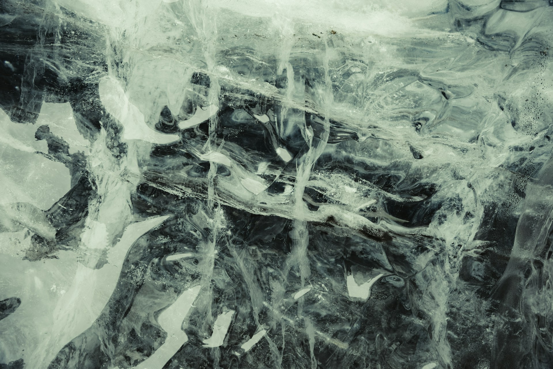 a black and white photo of ice and water