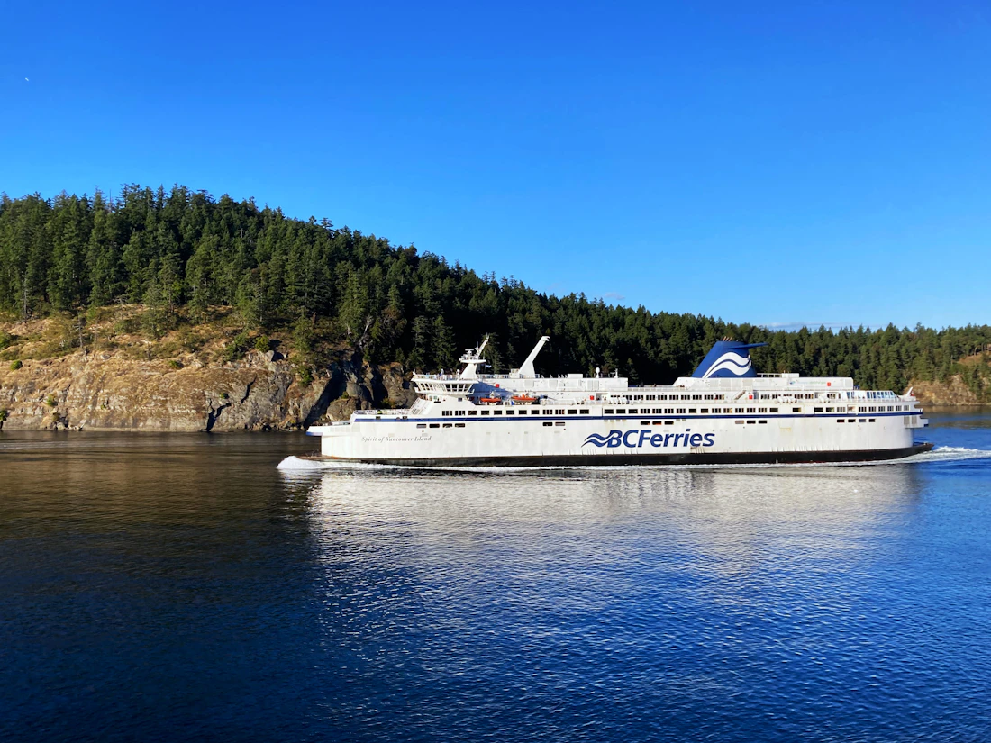 BC Ferries vessel crossing forested waters near Vancouver Island