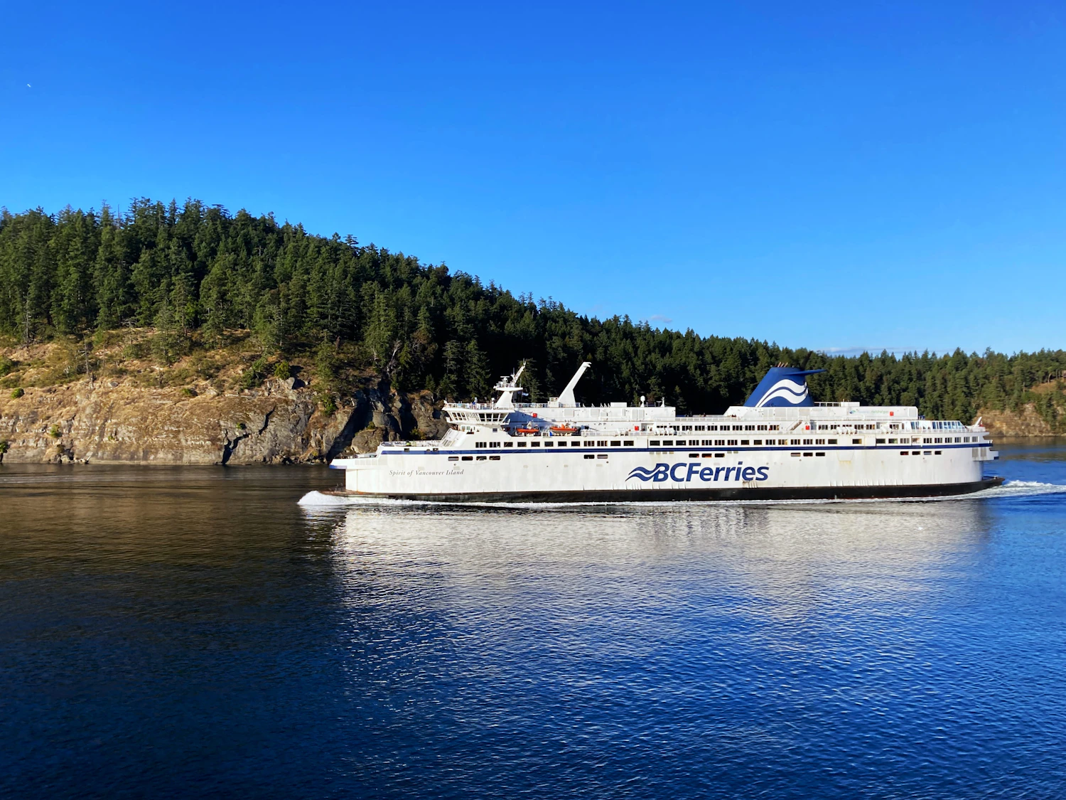 BC Ferries vessel crossing forested waters near Vancouver Island