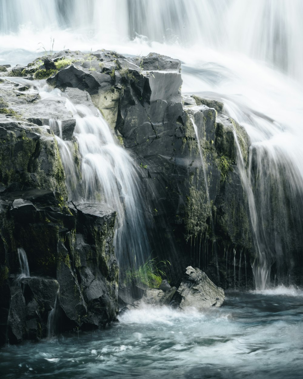 a large waterfall with lots of water coming out of it