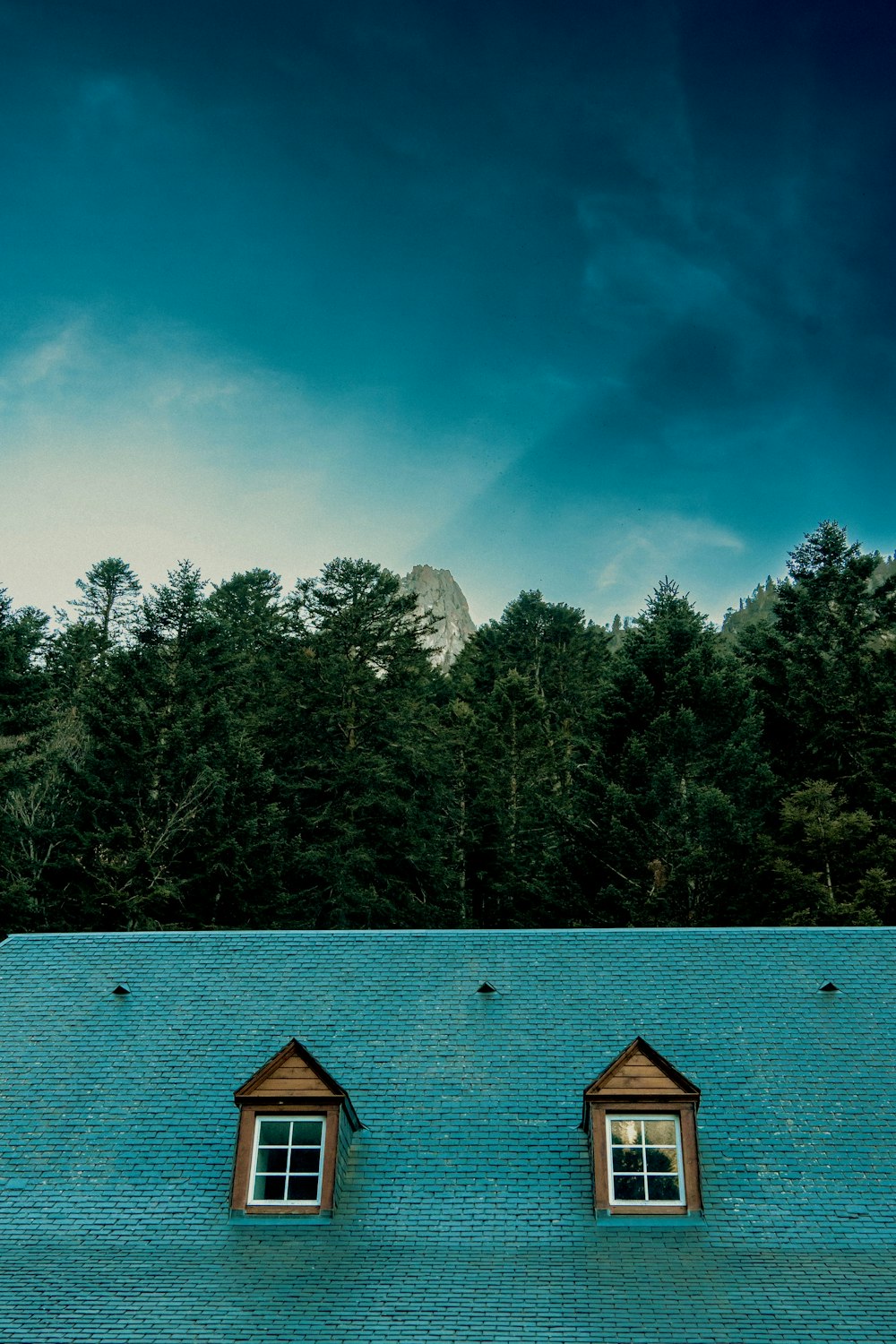 two windows on the roof of a building