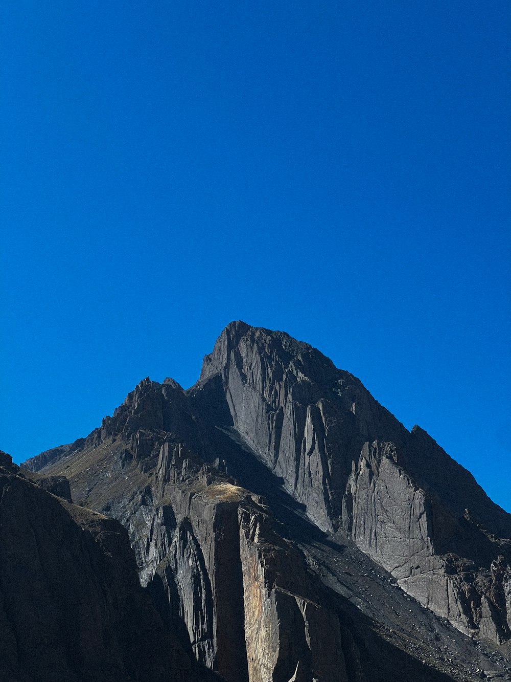 a very tall mountain with a sky background