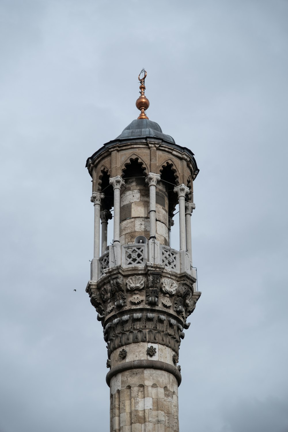 a tall tower with a clock on top of it