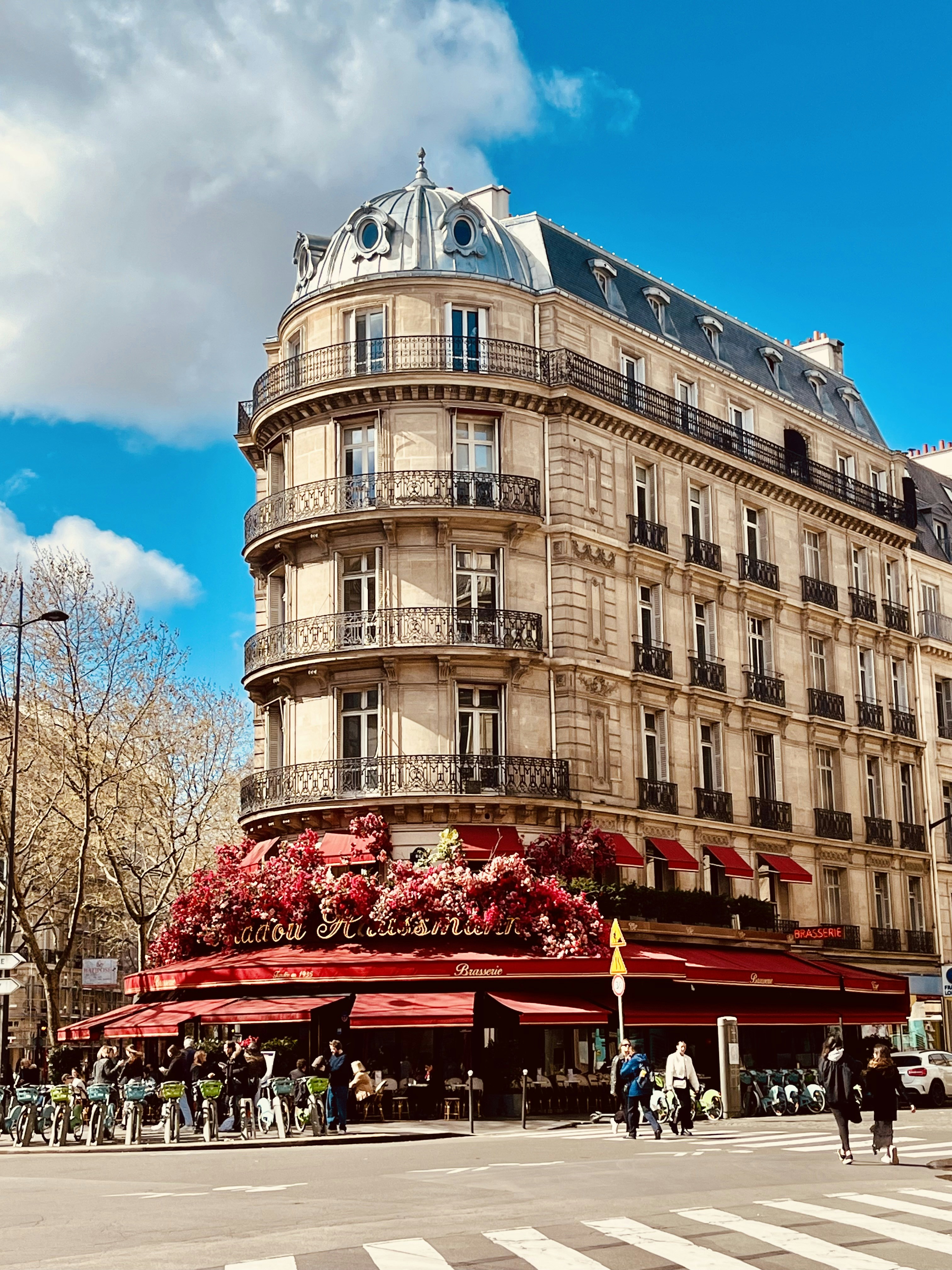 a very tall building sitting on the corner of a street