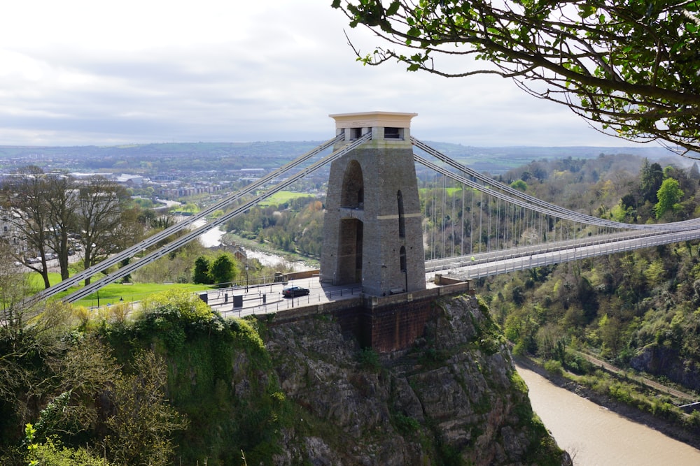 a view of a suspension bridge over a river