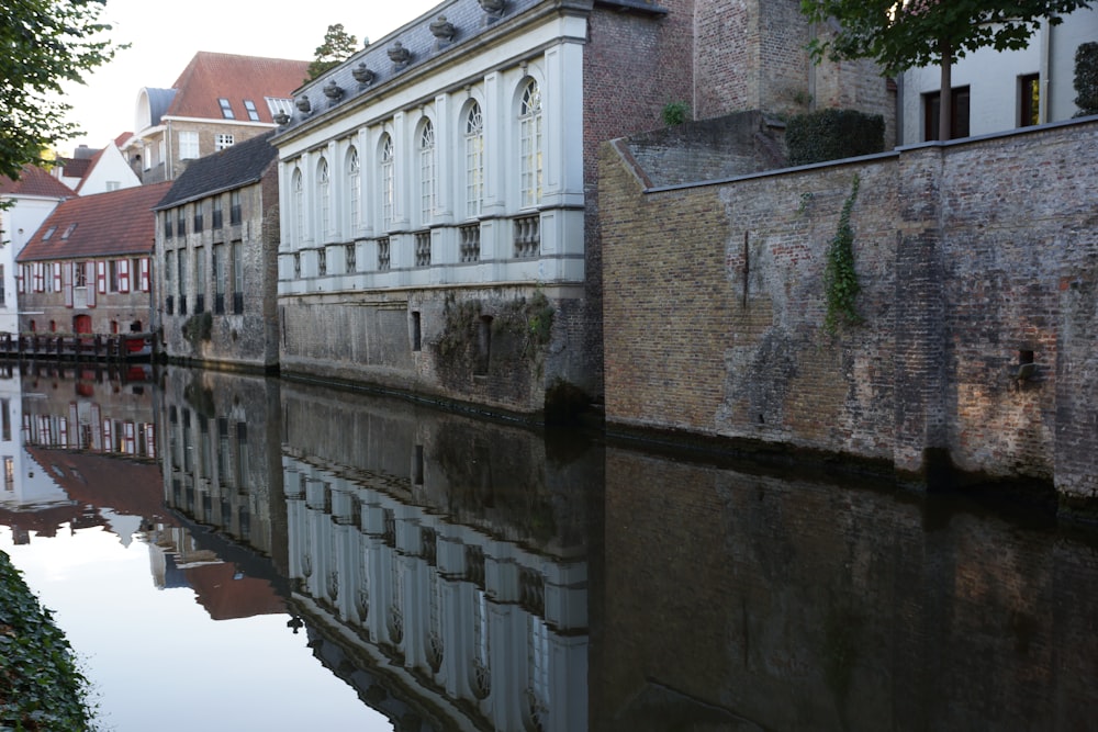 a river running through a city next to tall buildings