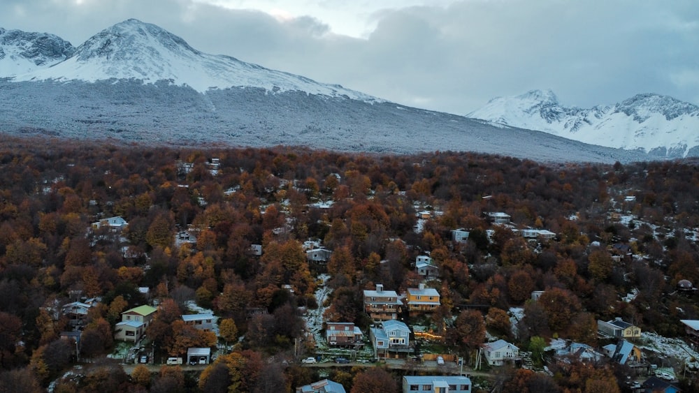 an aerial view of a town surrounded by mountains