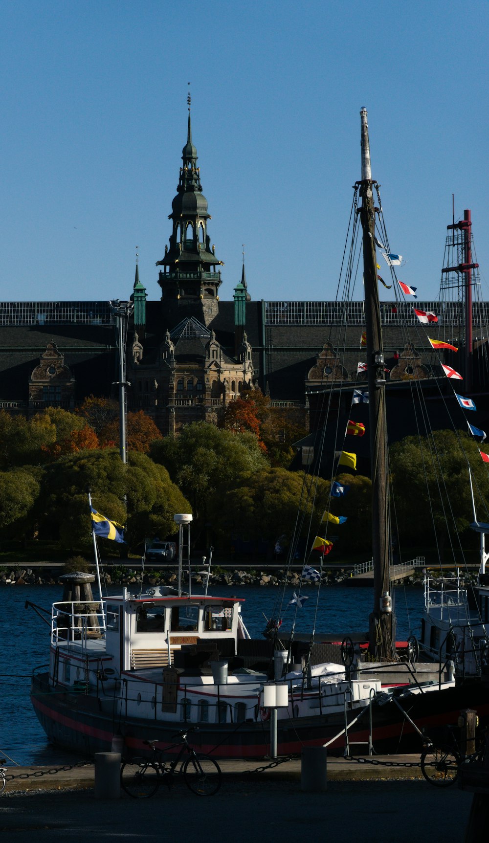 a boat is docked in front of a castle