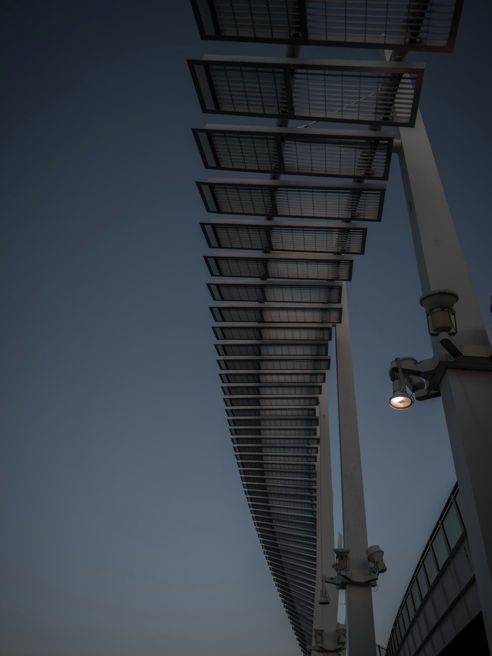 a street light sitting next to a tall building