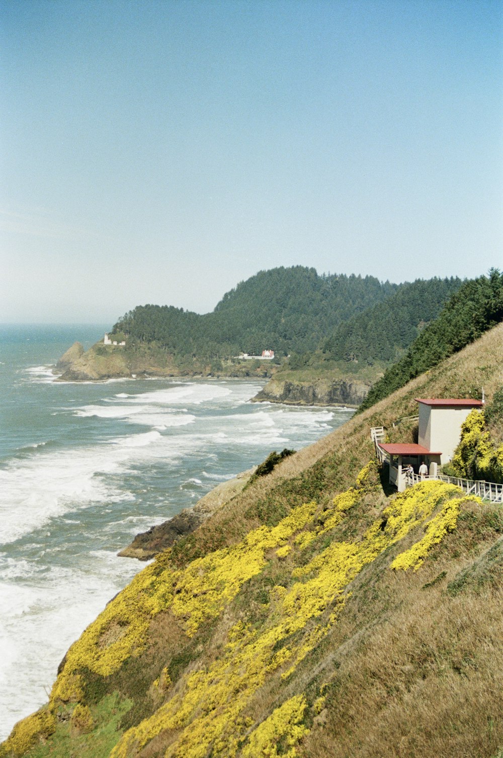 a house on a hill overlooking the ocean