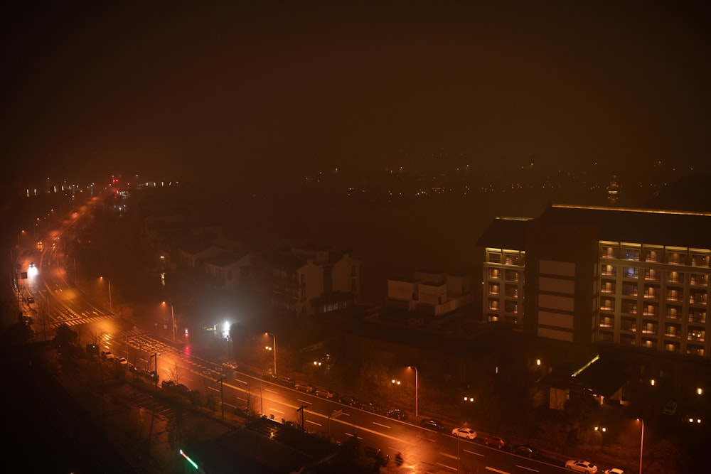 a city street at night with a lot of traffic