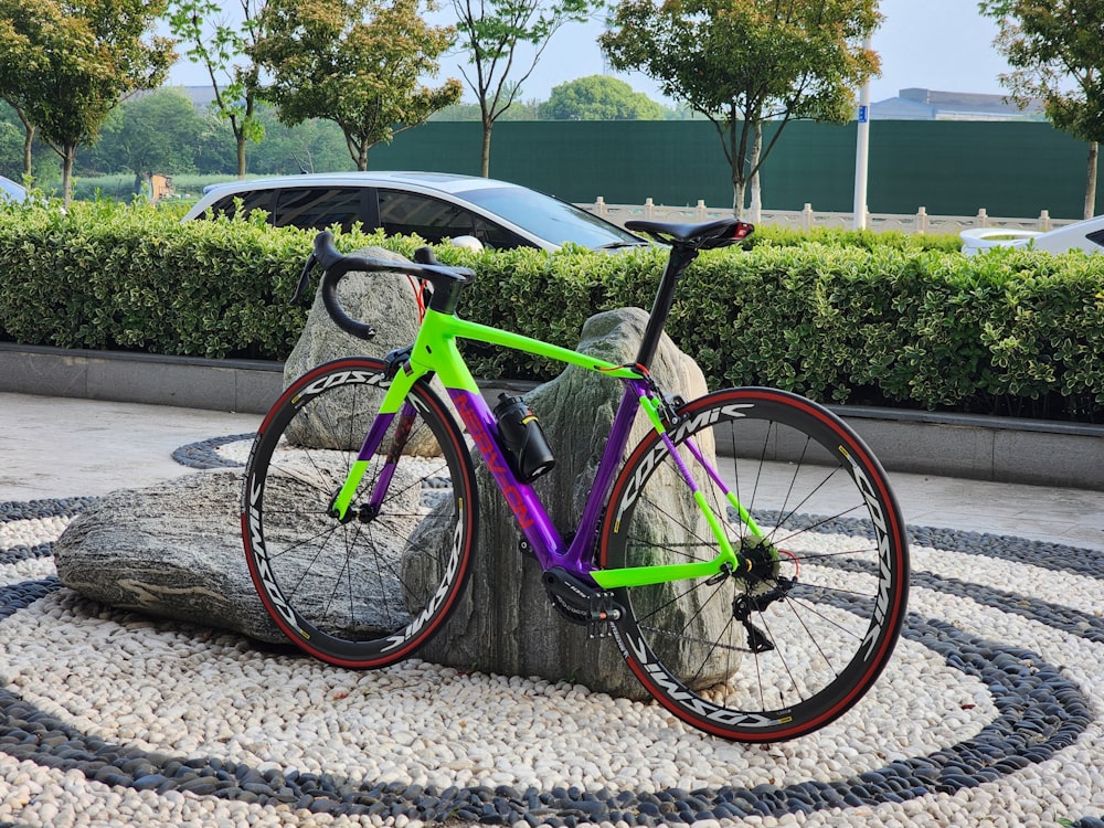 a bike is parked next to a tree stump