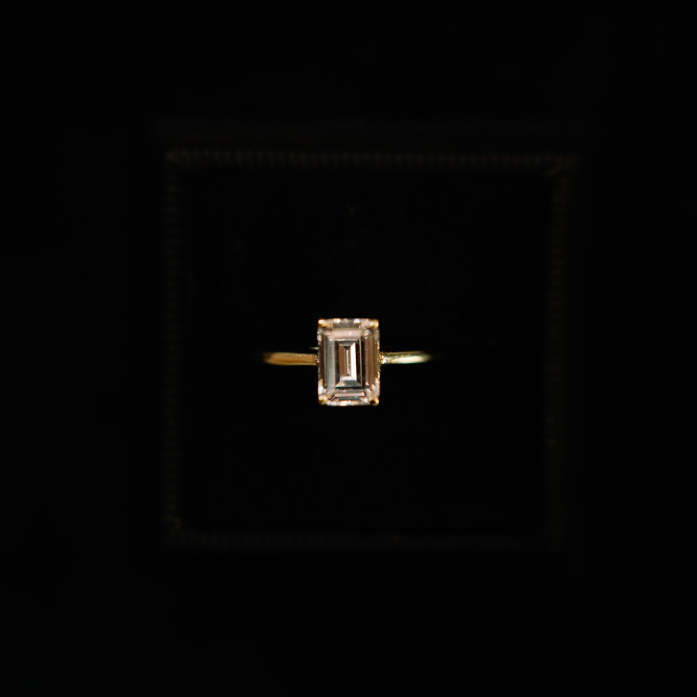 a ring with a square shaped diamond in the middle