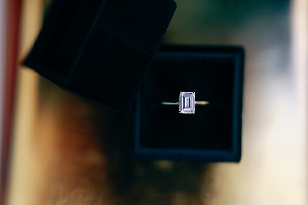 a ring with a baguette setting in a box