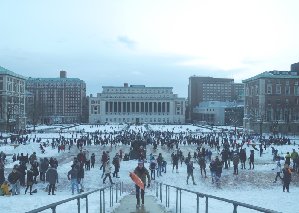 a large group of people standing in the snow