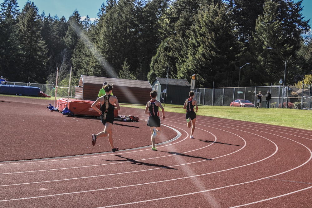 a group of people running on a track