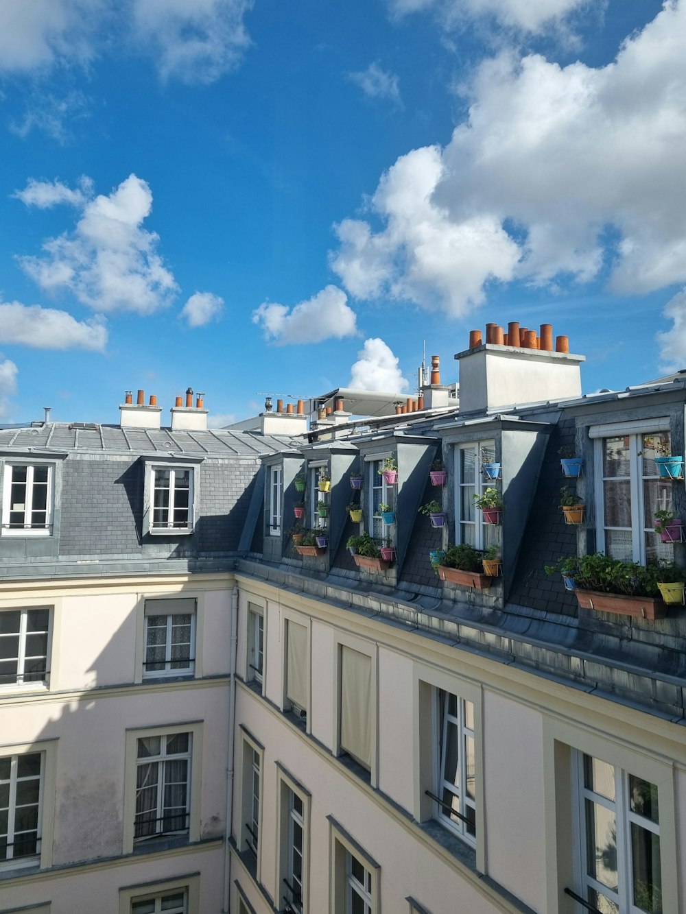 a row of buildings with a sky background