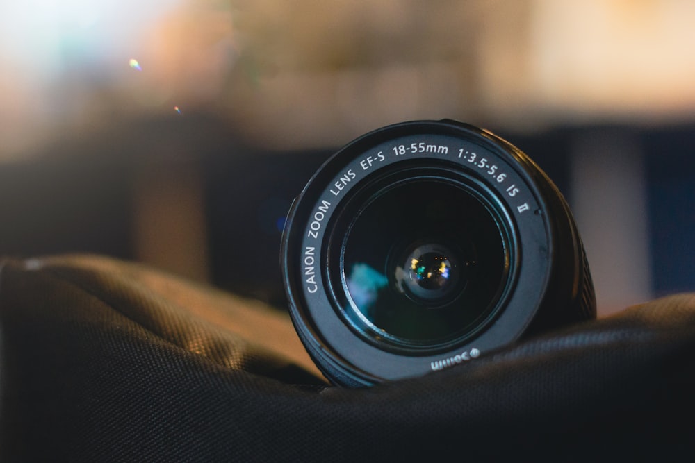 a close up of a camera lens on a person's arm