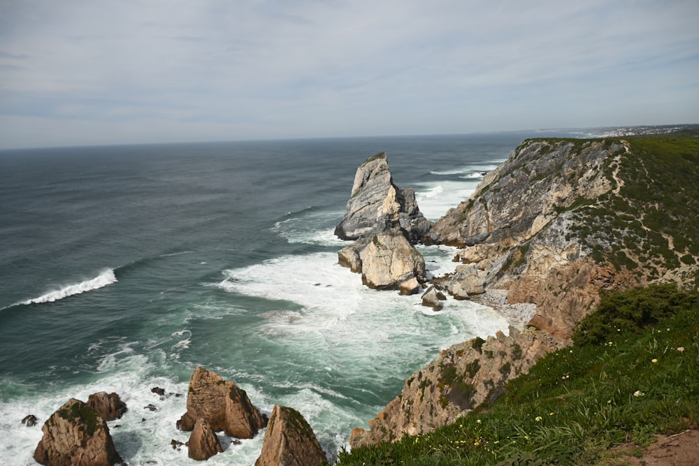 a view of the ocean from the top of a cliff