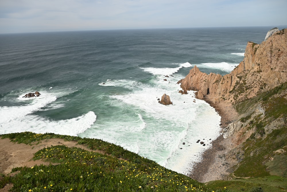 a view of the ocean from the top of a hill