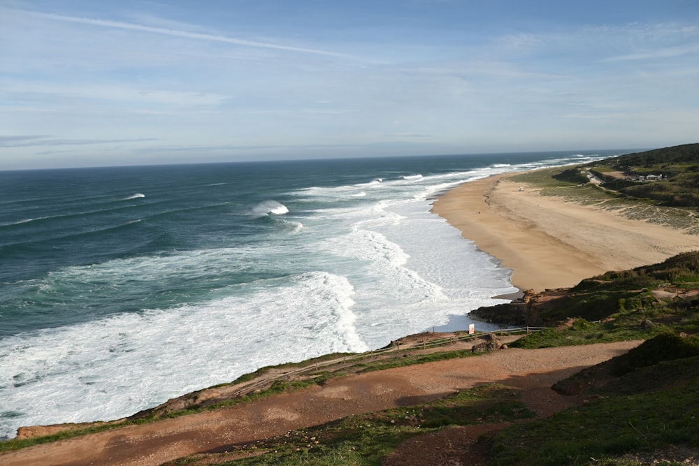 a view of a beach from a cliff