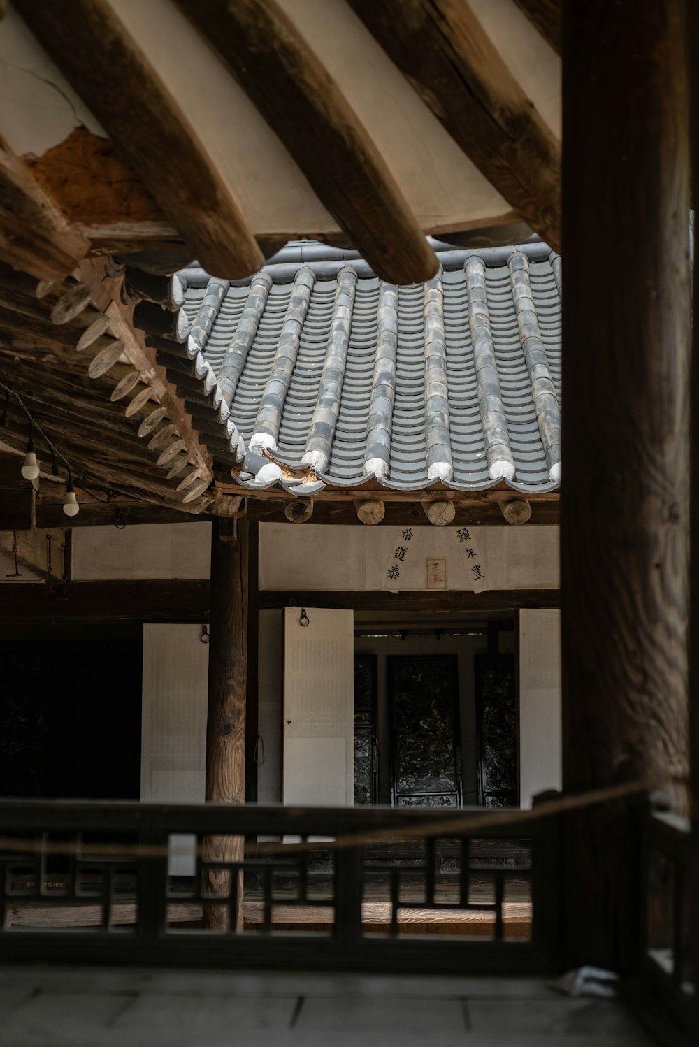 the roof of a building with wooden beams