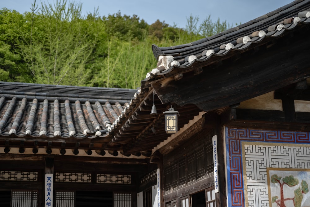 a building with a lantern hanging from it's roof