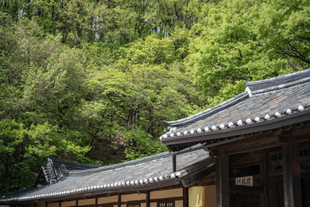 the roof of a building with trees in the background