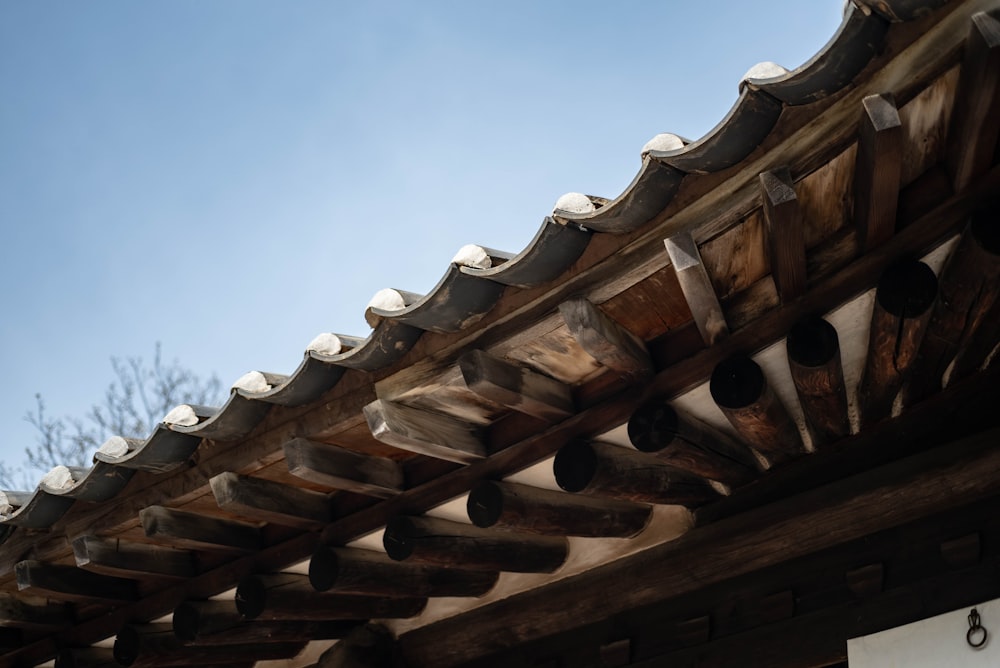 a close up of a roof with a sky in the background
