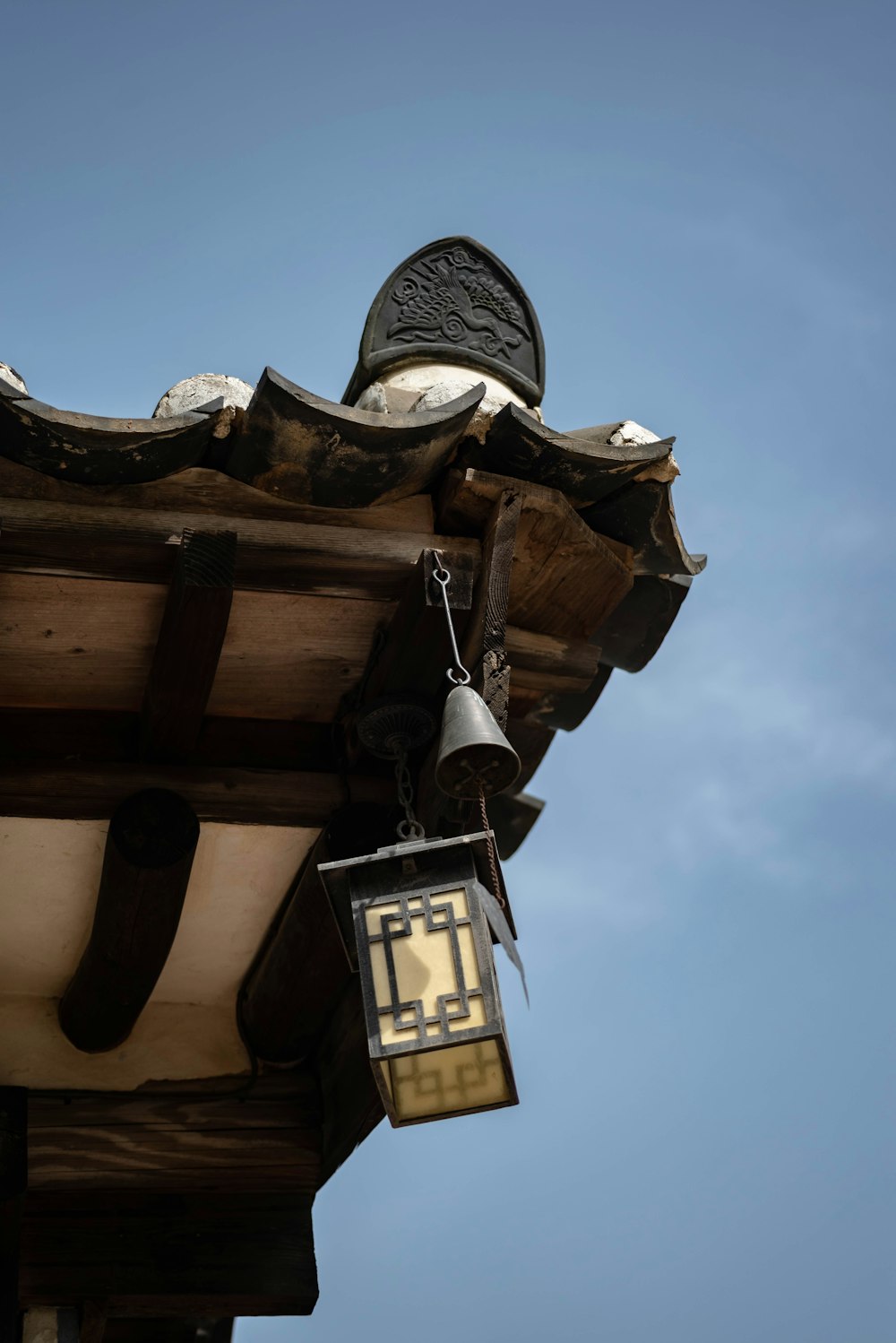 a lantern hanging from the roof of a building