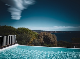 a swimming pool with a view of the ocean