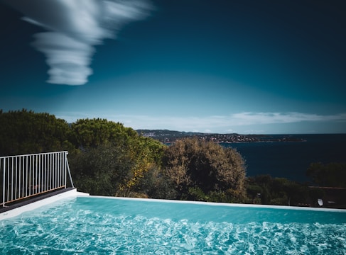 a swimming pool with a view of the ocean