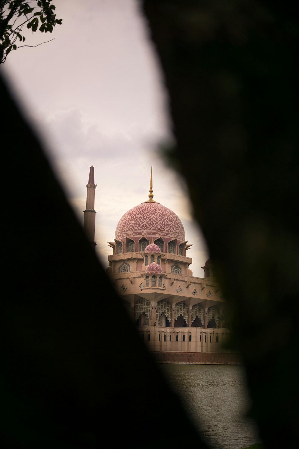 a view of a building through a hole in a wall