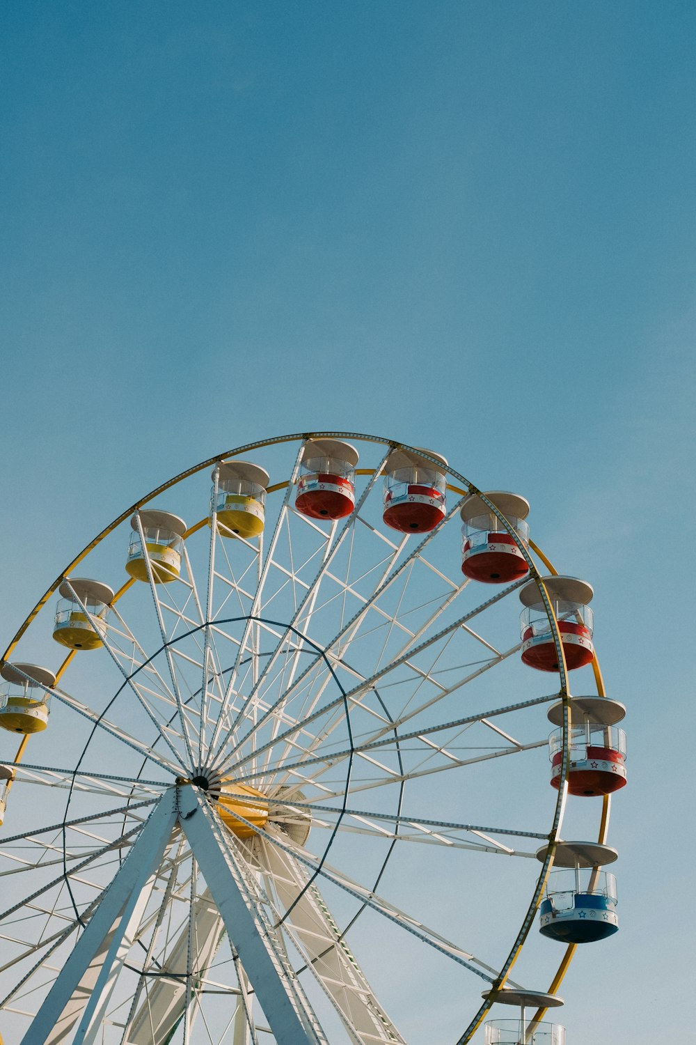 a ferris wheel with a blue sky in the background