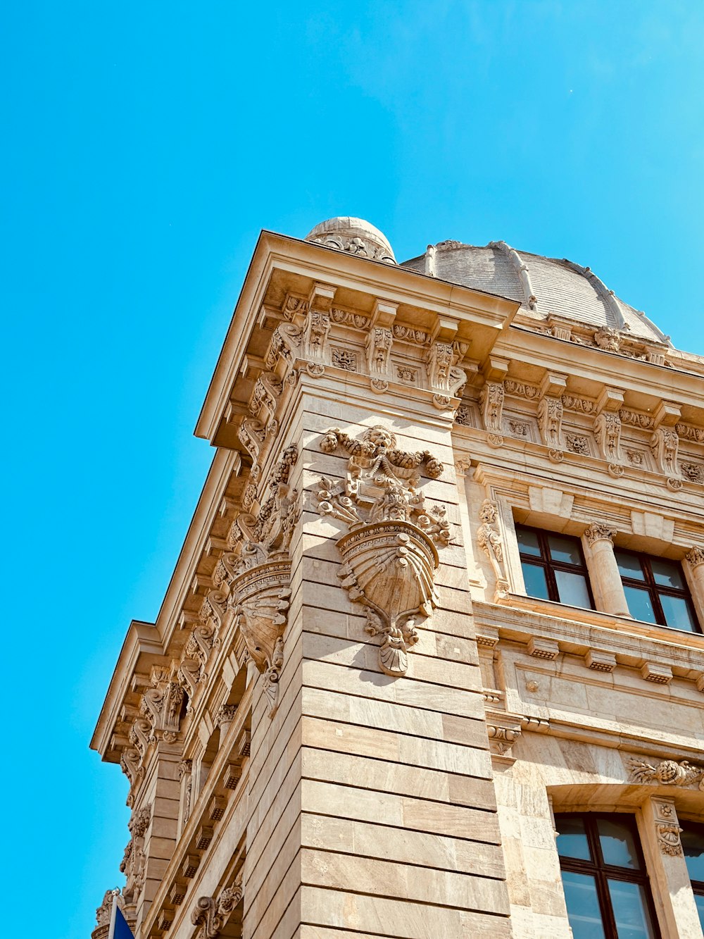 a tall building with a clock on the front of it