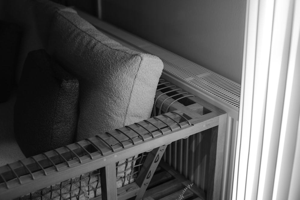 a black and white photo of a couch and a radiator