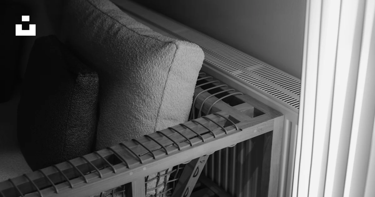 A black and white photo of a couch and a radiator photo – Free Grey ...