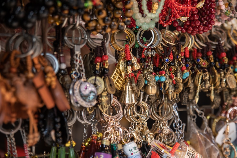a bunch of jewelry hanging on a wall