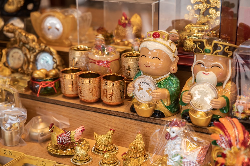 a display case filled with lots of gold items