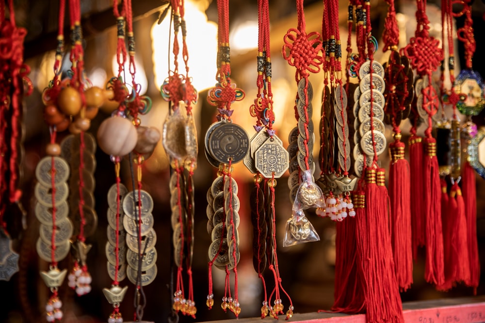 a bunch of necklaces hanging on a wall