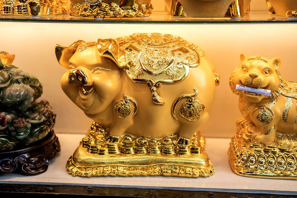 a collection of gold figurines on display in a store