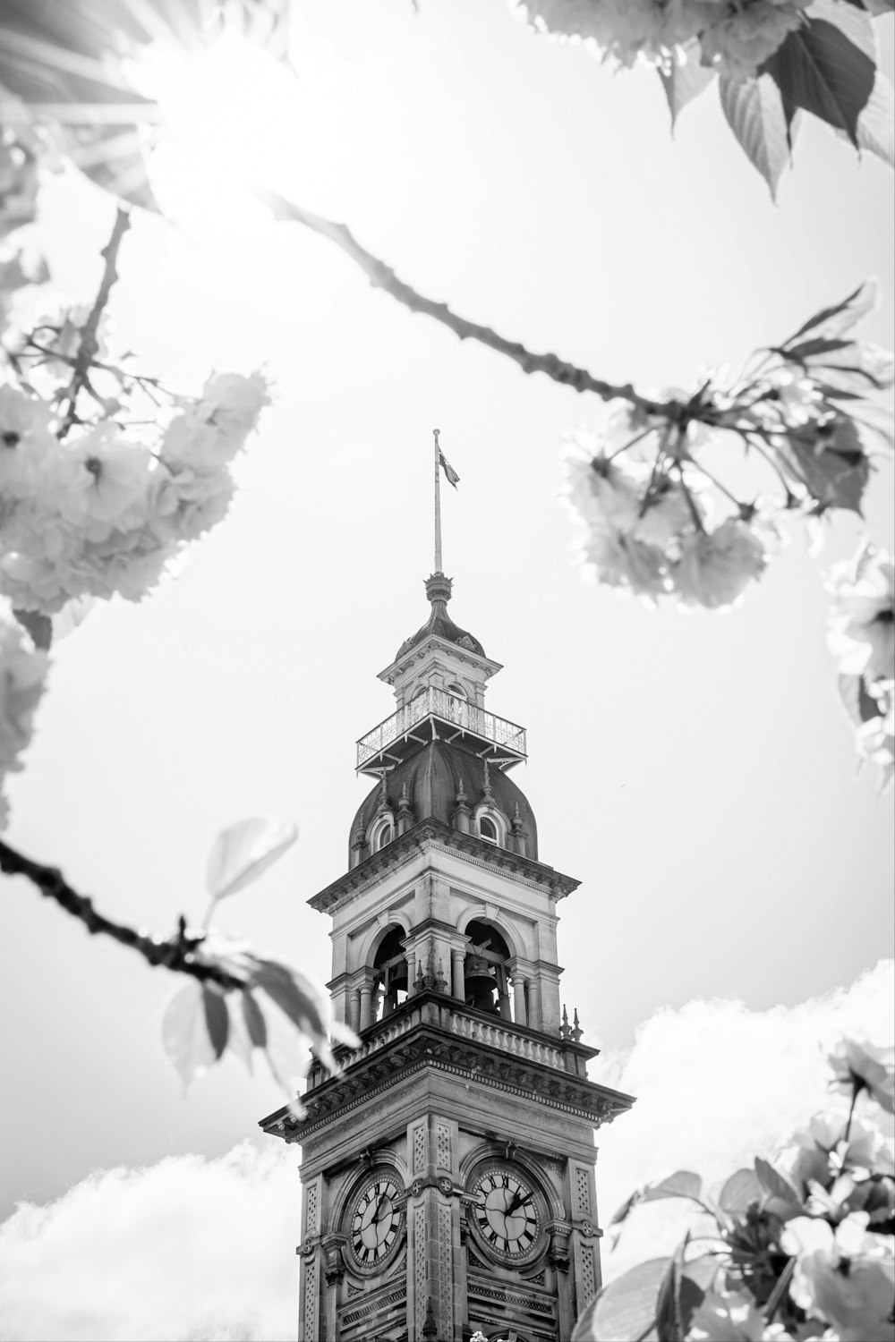 a black and white photo of a clock tower