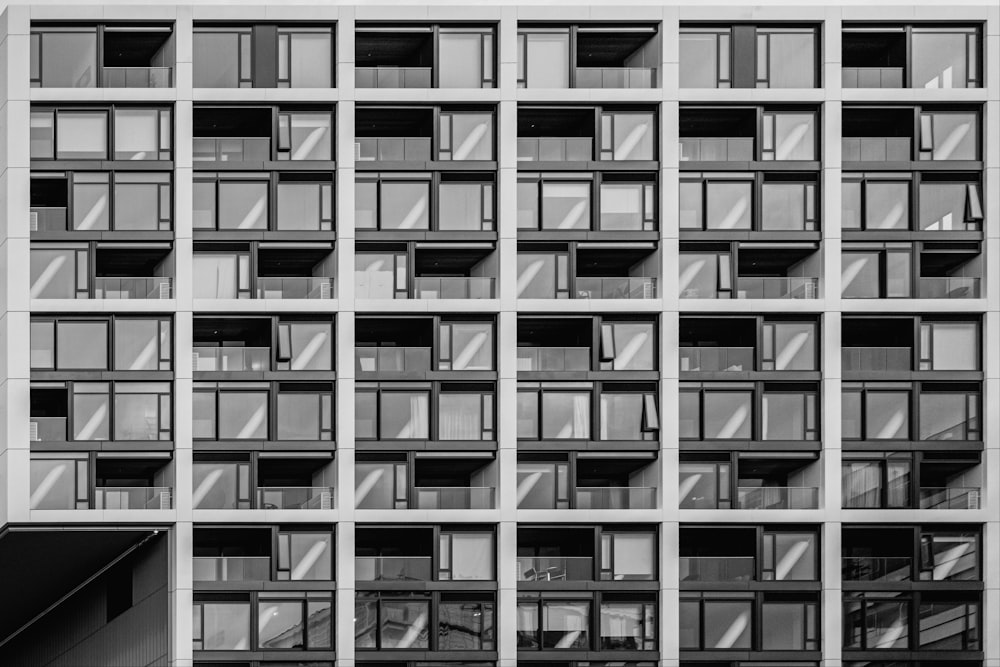 a tall building with lots of windows and balconies