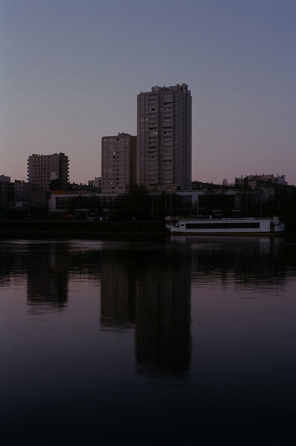 a body of water with buildings in the background