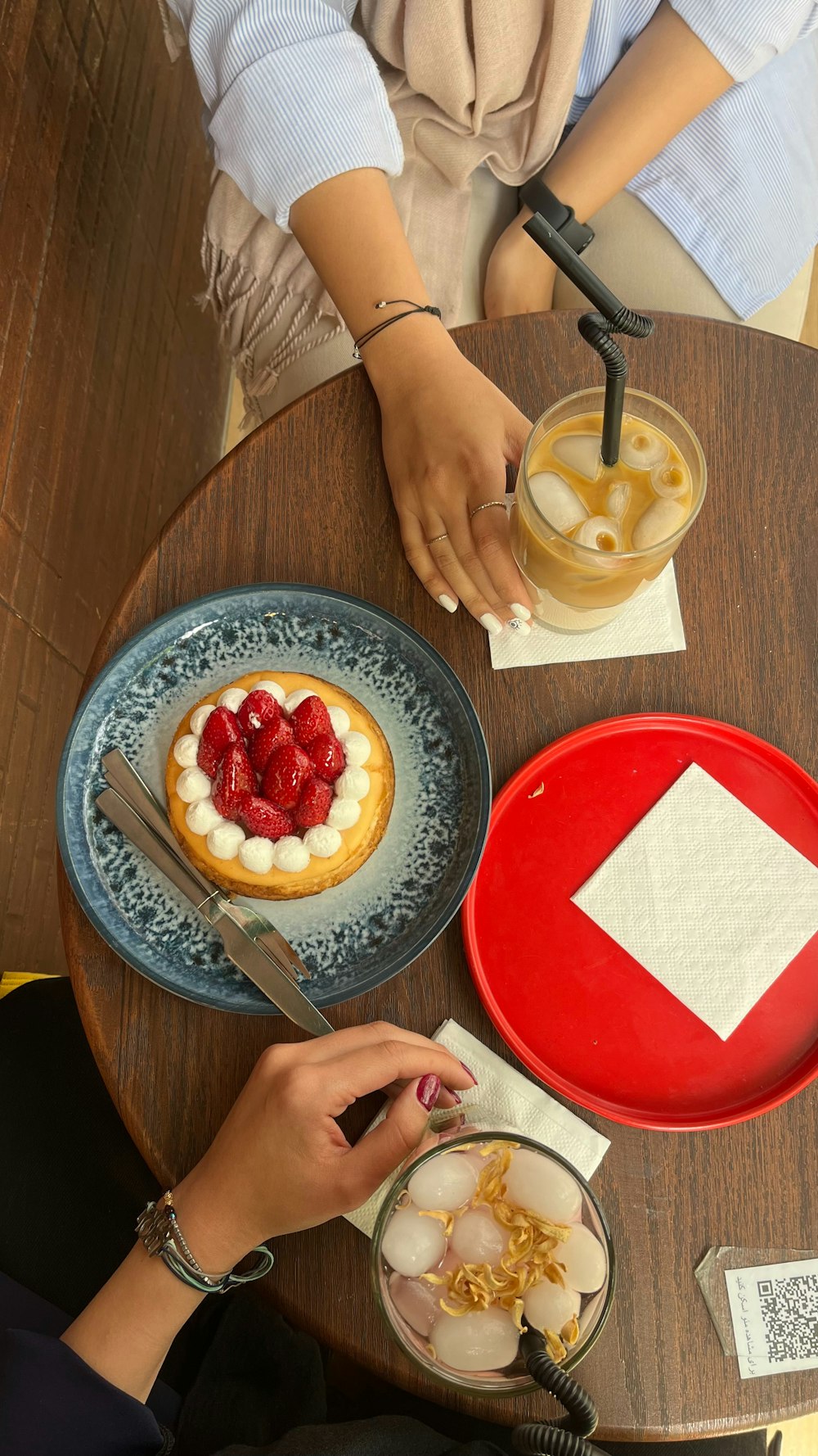 a person sitting at a table with a plate of food