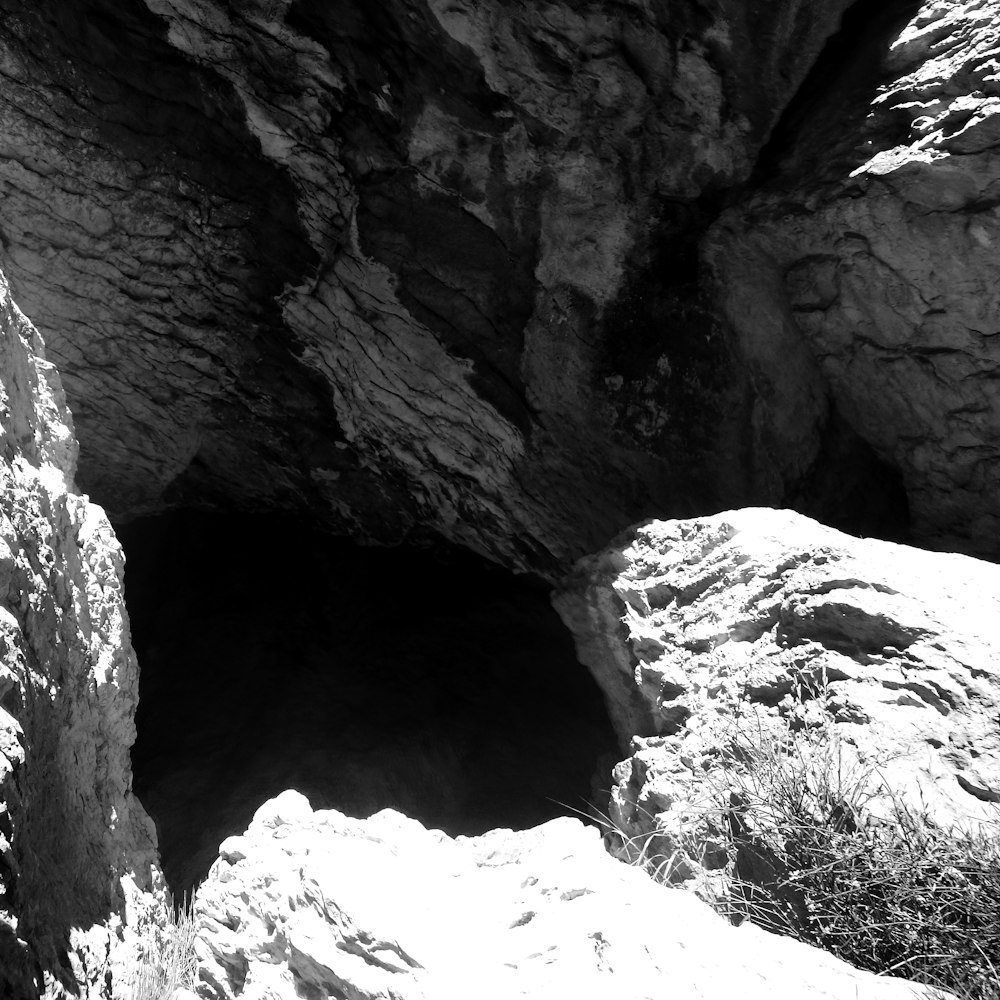 a black and white photo of a cave