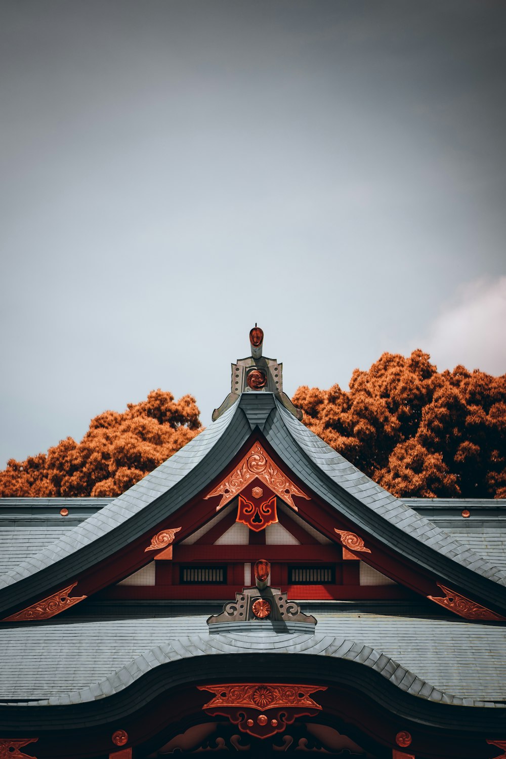 the roof of a building with trees in the background