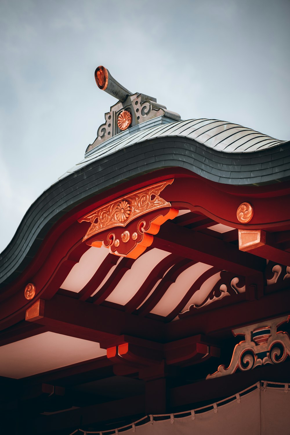 a close up of a roof with a sky in the background