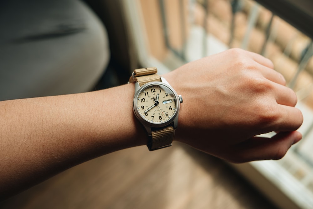 a close up of a person wearing a watch